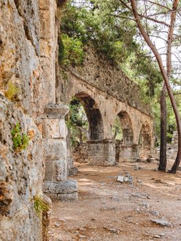 Ruins of large bath in ancient Phaselis city. Famous architectural landmark, Kemer district, Antalya province. Turkey.