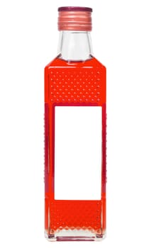 small rectangular glass bottle with vivid red liquid isolated on white background.
