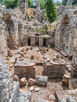 Ruins of large bath in ancient Phaselis city. Famous architectural landmark, Kemer district, Antalya province. Turkey.