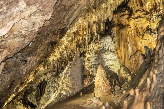 Han-sur-Lesse, Belgium - June 25, 2019: Grottes-de-Han 19 of 36. subterranean pictures of Stalagmites and stalactites in different shapes and colors throughout tunnels, caverns and large halls..