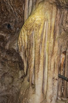 Han-sur-Lesse, Belgium - June 25, 2019: Grottes-de-Han 20 of 36. subterranean pictures of Stalagmites and stalactites in different shapes and colors throughout tunnels, caverns and large halls.. closeup.