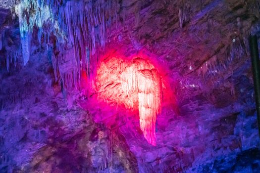 Han-sur-Lesse, Belgium - June 25, 2019: Grottes-de-Han 27 of 36. subterranean pictures of Stalagmites and stalactites in different shapes and colors throughout tunnels, caverns and large halls.. Lightshow.