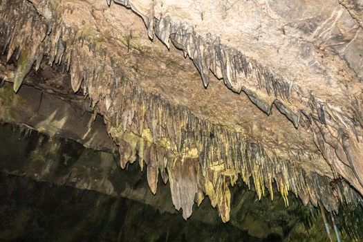 Han-sur-Lesse, Belgium - June 25, 2019: Grottes-de-Han 36 of 36. subterranean pictures of Stalagmites and stalactites in different shapes and colors throughout tunnels, caverns and large halls. Rock curtains.