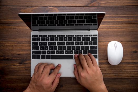 top view on man hand using laptop