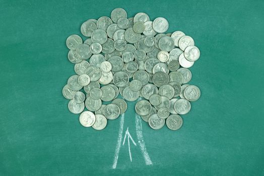 money coins tree on green chalk board