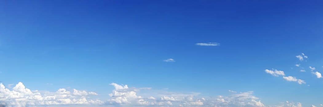 Blue sky with clouds on a sunny day. Beautiful cumulus cloud.