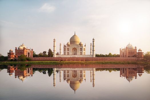 Sun set at Taj Mahal seen from Mehtab Bagh reflect on Yamuna river, an ivory-white marble mausoleum on the south bank of the Yamuna river in Agra, Uttar Pradesh, India. 