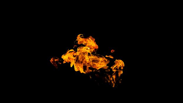 Fire flames on black background isolated. Burning gas or gasoline burns with fire and flames. Flaming burning sparks close-up, fire patterns. Infernal glow of fire in the dark with copy-space