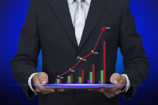 Hologram of success graph display chart pop up from tablet on Businessman's hand, cliping path include