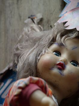 creepy old dirty doll face, shallow focus