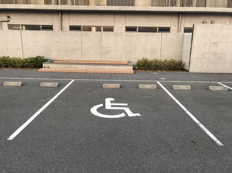 Handicapped Parking. Spaces at Office Building. symbol car park. Handicapped parking spot - transportation infrastructure road markings