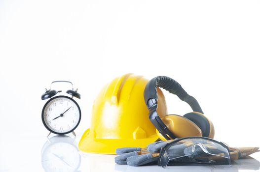 safety equipment for construction. Standard construction safety equipment. Personal protection equipment.Security tools for worker and Engineering. Yellow hard hat, Earphones, leather glove, safety glasses
