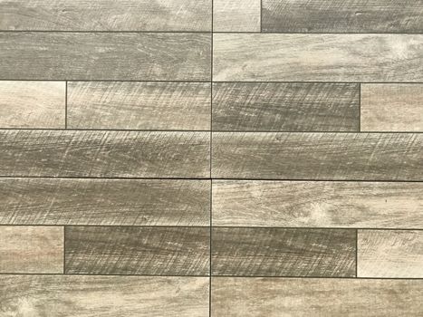 Wood texture on stone concrete flooring. wood texture background used in construction for paving, flooring as a wall covering. wood surface. Wood surface texture background. Home Material CERAMIC TILE.