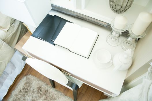white book page open on the table in luxury bedroom.