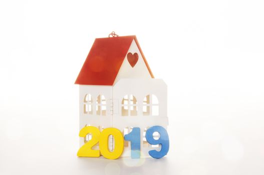 New Year 2019 is coming concept. Happy New Year 2019. Symbol from number 2019 and Home mock up on white background. Home Concept : Buy or Sale Real Estate in 2019  