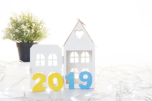 New Year 2019 is coming concept. Happy New Year 2019. Symbol from number 2019 and Home mock up on white background. Home Concept : Buy, Sale, Rent, Invesment, Mortgage, Loan, Financial, Buid, Renavate, Design, Interior, Decorate, Architecture 