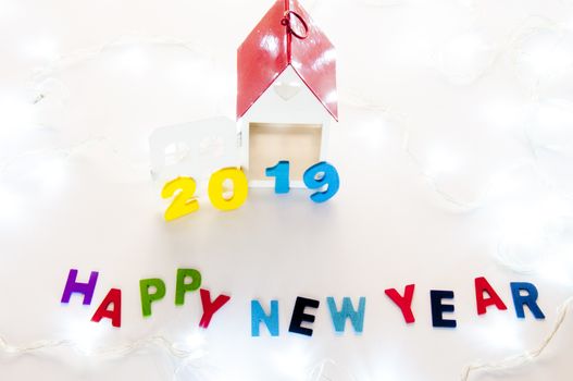 New Year 2019 is coming concept. Happy New Year 2019. Symbol from number 2019 and Home mock up on white background. Home Concept : Buy, Sale, Rent, Invesment, Mortgage, Loan, Financial, Buid, Renavate, Design, Interior, Decorate, Architecture 