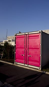 Cargo container for shipping and transportation work. Metal shipping container double doors. metal cargo container stands in port area, door face  