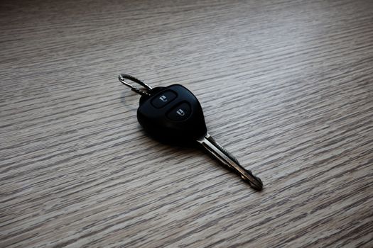 remote car key on wood background                                