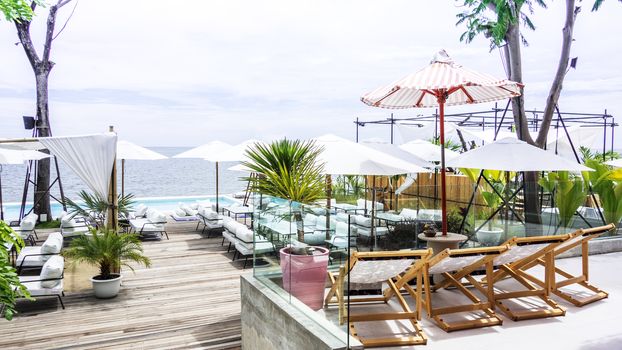 Sea view pool in restaurant. The sea view terrace at luxury restaurant. Dining table on the beach close to the ocean