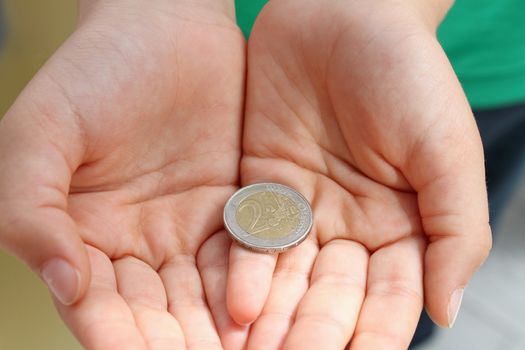 Child's hands  with money