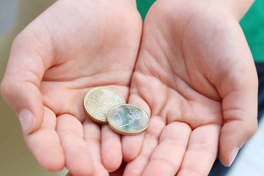 Child's hands  with money