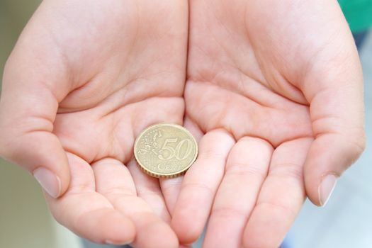 Child's hands  with money