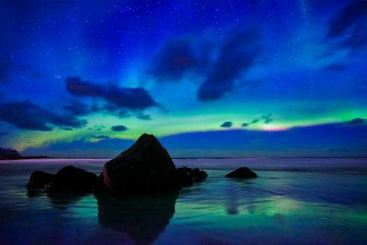 Aurora borealis northern lights on Skagsanden beach. Lofoten Islands, Norway