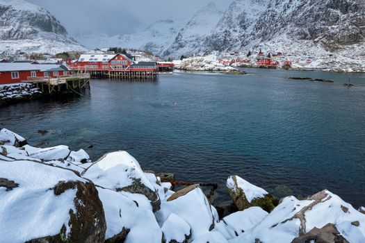 Traditional fishing village A on Lofoten Islands, Norway with red rorbu houses. With snow in winter