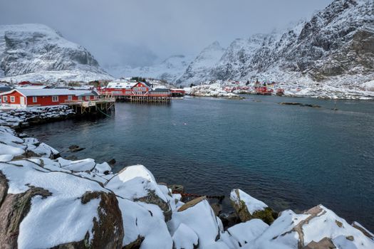 Traditional fishing village A on Lofoten Islands, Norway with red rorbu houses. With snow in winter