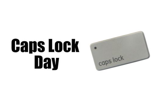 CAPS LOCK DAY text and computer keyboard on white background. Holiday and Technology concept