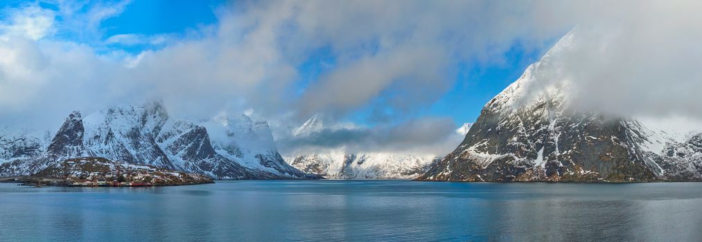 Panorama of Norwegian fjord and mountains with snow in winter. Lofoten islands, Norway