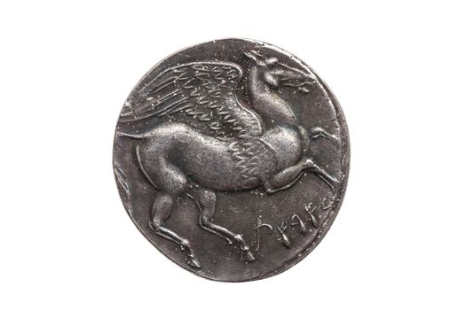 Silver 5 shekel Carthaginian coin replica with portrait of Tanit the sky goddess and the winged horse Pegasus on the reverse from the First Punic War 264-260 BC cut out isolated on a white background