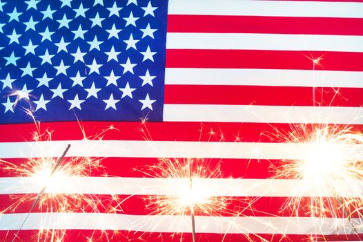 Celebrating Independence Day. United States of America USA flag with sparklers background