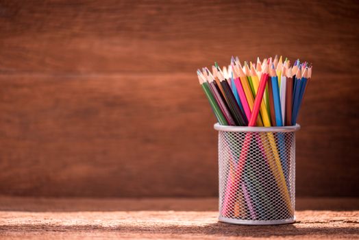 pencil box on wooden table.