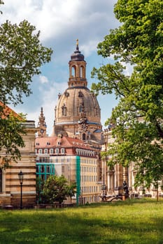 Dome of the Frauenkirche church, view from the side of the park, Dresden, Germany.