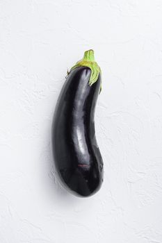 Ripe aubergine or eggplant on white background Top view