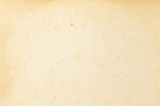 Brown kraft paper background texture with grain and dots