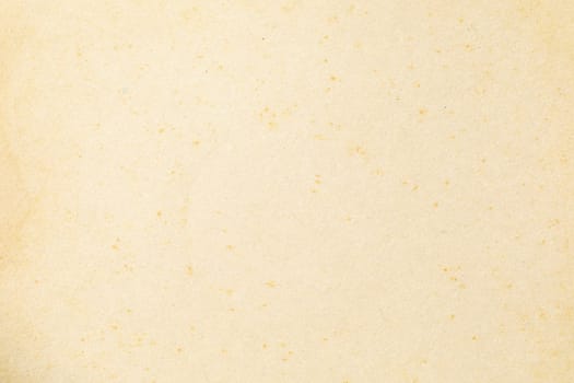 Brown kraft paper background texture with grain and dots