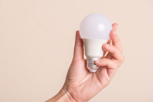 woman hand holding light bulb.