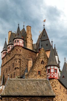 fairytale castle Eltz on the Moselle, Germany, with dramatic sky



