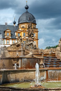 Seehof Palace and Park, Fountain on the background of the castle, Bavaria, Germany.