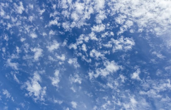 Blue sky background with tiny clouds white.