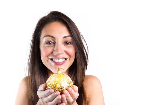 Christmas ball in hand of smiling woman over white. Christmas concept.