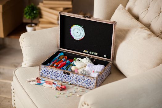 casket for needlework with flower, sewing in style interior