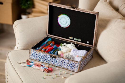 casket for needlework with flower, sewing in style interior