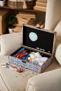 casket for needlework with flower, sewing in style interior