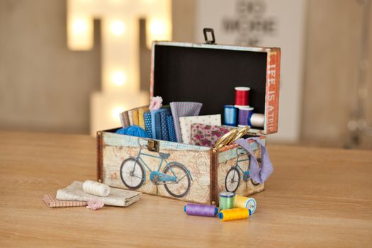 casket for needlework with flower, sewing in style interior