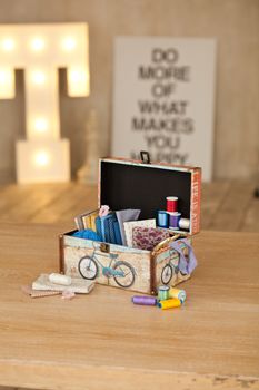 casket for needlework with flower, sewing in style interior