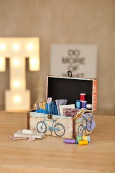 casket for needlework with flower, sewing in style interior
